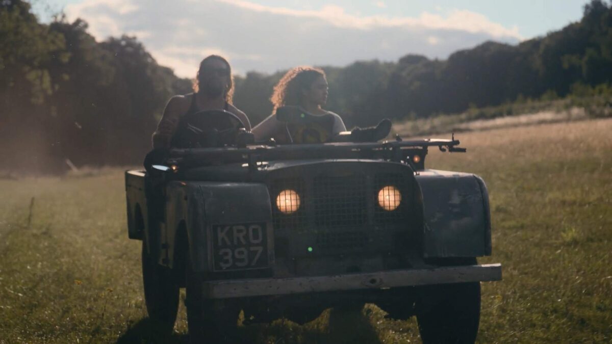 Close-up of Jason Mamoa driving Electrogenic Series Land Rover Convertion